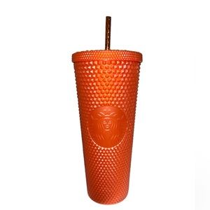 orange studded starbucks cup